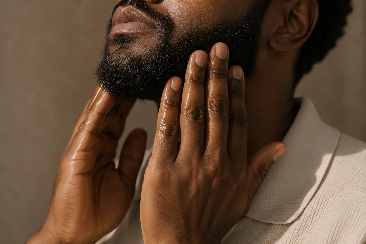 THE OIL worked through a beard and the skin beneath it